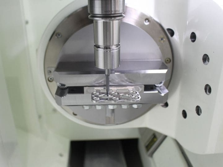 Precision machining of a medical implant using a 5-Axis milling system.