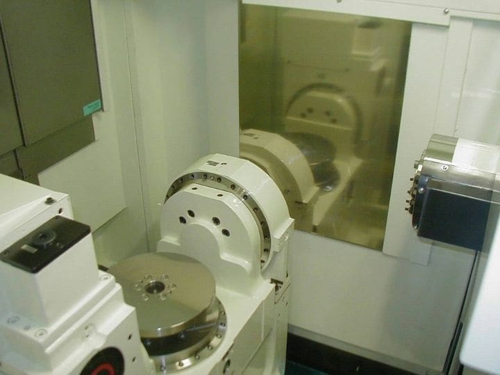 Interior of Kitamura Supercell 400G with dual-axis rotary table for precision machining.