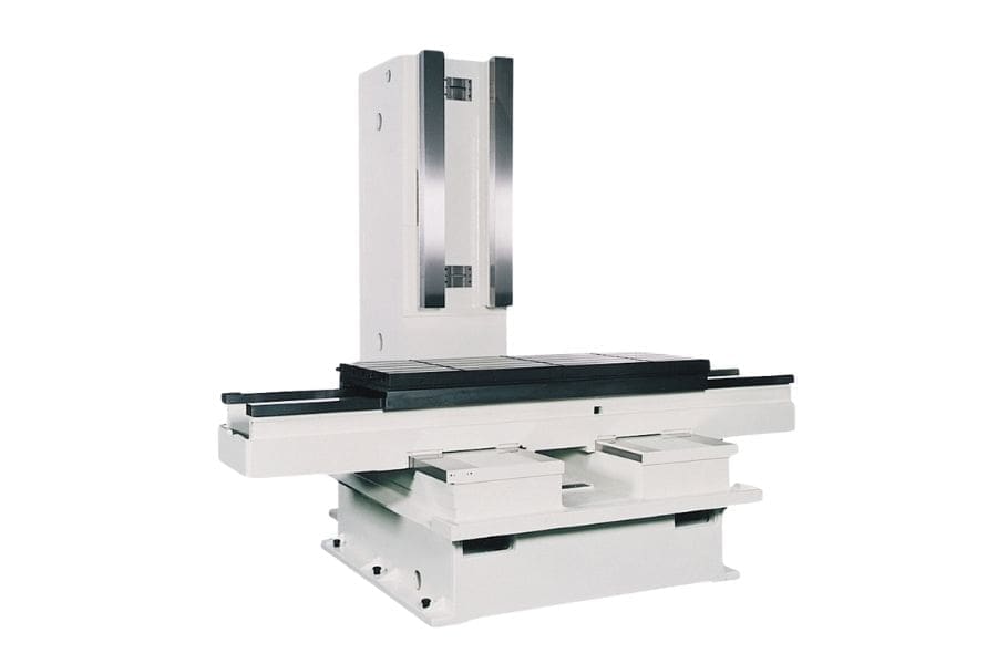 Structural base of a vertical machining center (VMC), featuring the worktable, column, and guideways for spindle and tool movement.